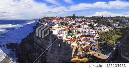 Portugal travel and landmarks. Azenhas do mar - charming coastal village on the cliff . Aerial panoamic view of white houses and atlantic ocean 123135988