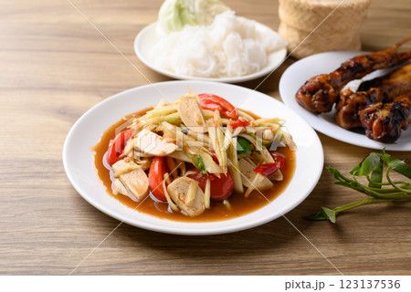 Thai food (Som Tum), Spicy papaya salad with pork sausage Thai food (Som Tum), Spicy papaya salad with pork sausage 123137536