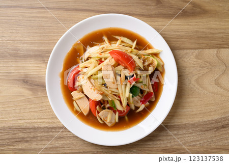 Thai food (Som Tum), Spicy papaya salad with pork sausage, Local Thai food, Table top view 123137538