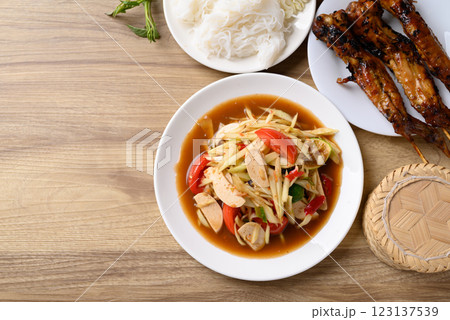 Thai food (Som Tum), Spicy papaya salad with pork sausage Thai food (Som Tum), Spicy papaya salad with pork sausage 123137539