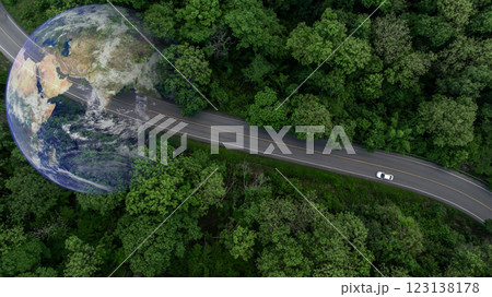 Aerial view EV car electric vehicle car alternative sustainable energy eco power, EV car electric vehicle car on middle green tree forest road with globe earth planet, Alternative sustainable energy. Aerial view EV car electric vehicle car alternative sustainable energy eco power, EV car electric vehicle car on middle green tree forest road with globe earth planet, Alternative sustainable energy. 123138178