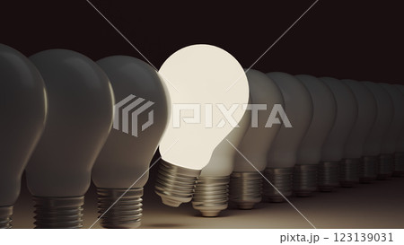 Among a row of light bulbs, one glows brighter, illustrating an idea concept and career individuality. 123139031