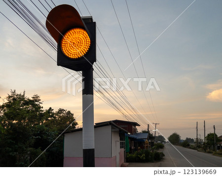 Rural amber traffic light at dusk - Road safety in country. 123139669