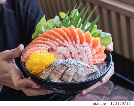 Sashimi Sushi Set on Plate Delicious sashimi bowl with fresh fish and octopus. Sashimi Sushi Set on Plate Delicious sashimi bowl with fresh fish and octopus. 123139710