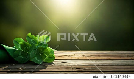 Green clover leaves on rustic wood with sun rays in the background. Green clover leaves on rustic wood with sun rays in the background. 123140448