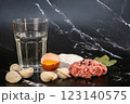 Ingredients for making meat dumplings on dark background, closeup 123140575