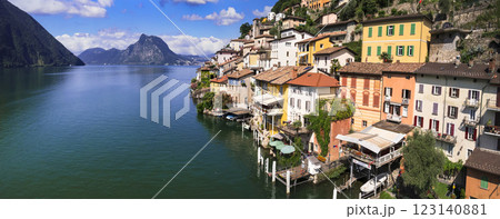 most beautiful traditional villages of Switzerland - scenic Gandria with colorful houses in lake Lugano, canton Ticino . Border with Italy. Aerial drone panoramic view 123140881