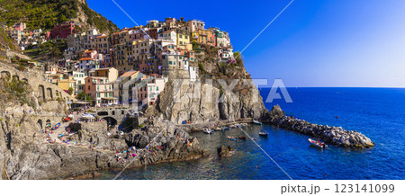 Italy, Cinque terre famous national park of traditional fishing villages. Manarola  colorful houses and picturesque bay. popular tourist attraction in Liguria 123141099