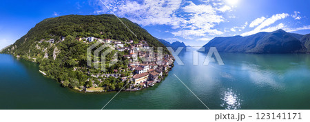 most beautiful traditional villages of Switzerland - scenic Gandria with colorful houses in lake Lugano . Border with Italy. Aerial drone panoramic view 123141171