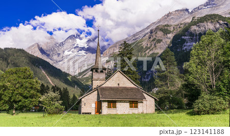 Switzerland scenic places. picturesque Kanderseg village and ski resort surrouded by impressive Alps mountains. Canton of Bern, view with old wooden church 123141188