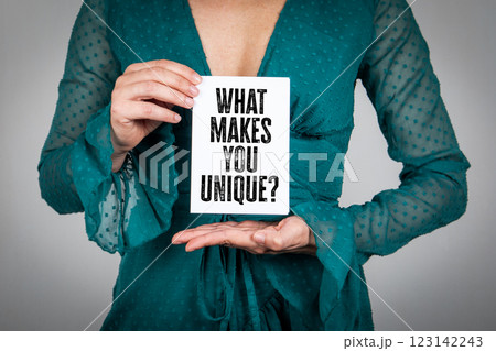 What makes you unique. Woman holding a notepad What makes you unique. Woman holding a notepad 123142243