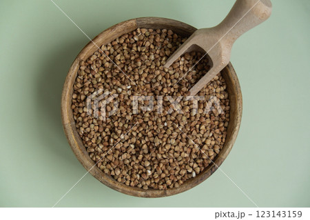 Raw buckwheat porridge Gluten free cereals. Health gut benefits. Concept of alternative whole spelt grain ingredient. Vegetarian diet recipes. Plant-based lifestyle. Copy space Protein rich 123143159