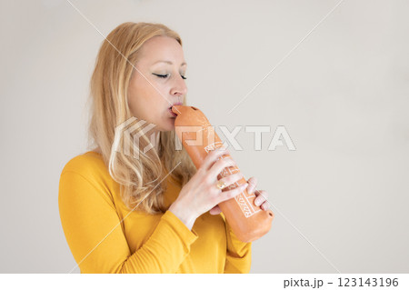 Portrait of female musician playing on traditional clay flute. Woman playing ocarina Portrait of female musician playing on traditional clay flute. Woman playing ocarina 123143196