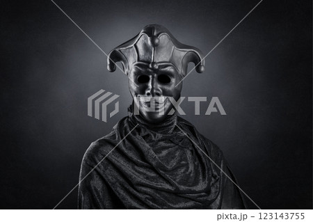 Portrait of a scary medieval clown over dark misty background with clipping path 123143755