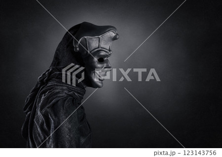 Portrait of a scary medieval clown over dark misty background with clipping path 123143756