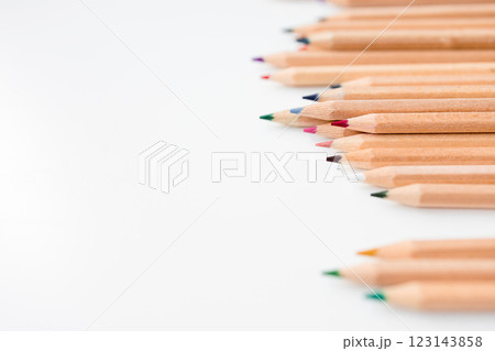 Colorful wooden colored pencils arranged horizontally on white background Colorful wooden colored pencils arranged horizontally on white background 123143858