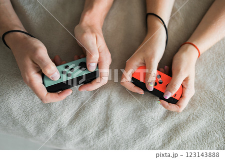 Hands using game controller. Playing video games Hands using game controller. Playing video games 123143888