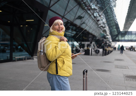 International airport terminal. Asian beautiful woman with luggage and walking in airport International airport terminal. Asian beautiful woman with luggage and walking in airport 123144025