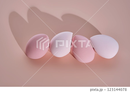 A set of makeup sponges on a pink background. A set of makeup sponges on a pink background. 123144078