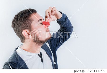 Concept of nasal congestion and nosebleed. Person with nosebleed isolated 123144143