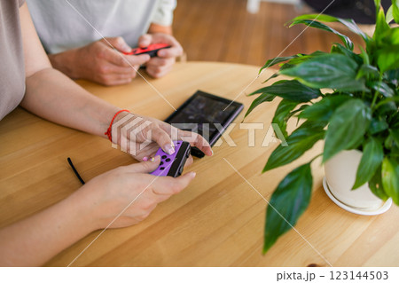 Hands using game controller. Playing video games Hands using game controller. Playing video games 123144503