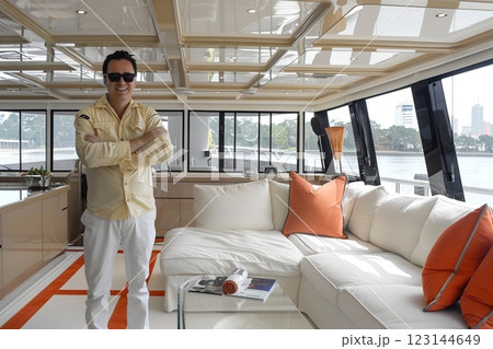 A man enjoys a luxurious yacht interior with a modern design A man enjoys a luxurious yacht interior with a modern design 123144649