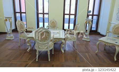 An Elegant Vintage Dining Room Furniture Set Featuring Beautifully Decorative Chairs 123145422