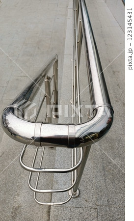 A contemporary and modern stainless steel handrail design prioritizing safety and elegance 123145431