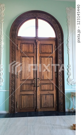 Elegant and Beautiful Wooden Double Doors Featuring a Graceful Arched Top Design Elegant and Beautiful Wooden Double Doors Featuring a Graceful Arched Top Design 123145440