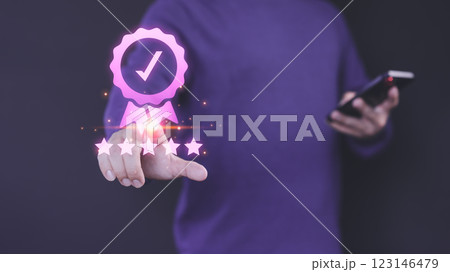 Person interacts with a digital five-star rating interface, symbolizing high-quality service. A checkmark badge emphasizes quality assurance, reflecting user satisfaction and trust in online platform. Person interacts with a digital five-star rating interface, symbolizing high-quality service. A checkmark badge emphasizes quality assurance, reflecting user satisfaction and trust in online platform. 123146479