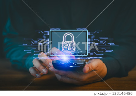 Person uses a smartphone displaying a digital padlock icon, symbolizing data security and privacy protection. The glowing lock and circuit patterns emphasize modern cybersecurity measures. Person uses a smartphone displaying a digital padlock icon, symbolizing data security and privacy protection. The glowing lock and circuit patterns emphasize modern cybersecurity measures. 123146486
