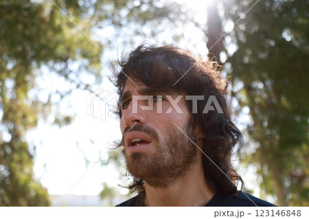 Scared Boy Raises His Hands Before Receiving Theft From A Criminal In a Park 123146848