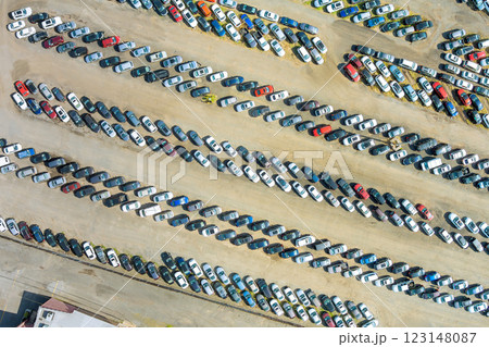 Aerial view of large parking lot showcasing various vehicles lined up neatly 123148087