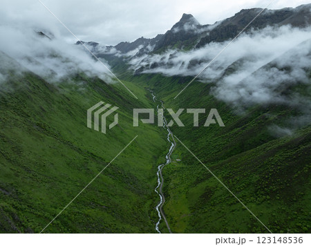 Aerial view of beautiful high altitude grassland mountain landscape Aerial view of beautiful high altitude grassland mountain landscape 123148536