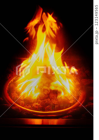 Cozy Fire Pit Glowing Flames Charcoal Heat Warm Relaxing Ambiance Cozy Fire Pit Glowing Flames Charcoal Heat Warm Relaxing Ambiance 123149565