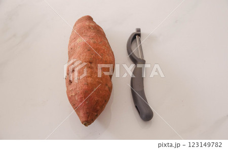 Fresh Sweet Potato Peeler Kitchen Essentials, campaing Fresh Sweet Potato Peeler Kitchen Essentials, campaing 123149782