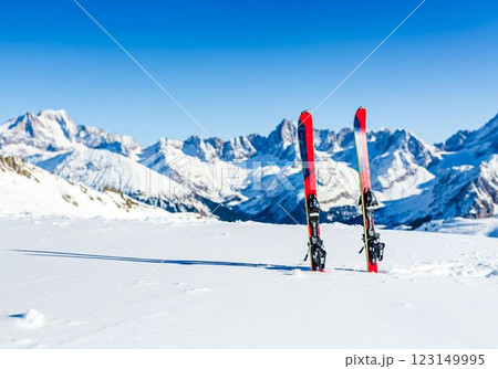 Skiing Adventure Red Skis Standing in Snow with Mountain View 123149995