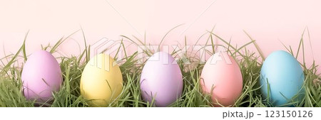 Pastel Easter Eggs in Grass with Soft Pink Background Minimalist Spring Design Pastel Easter Eggs in Grass with Soft Pink Background Minimalist Spring Design 123150126