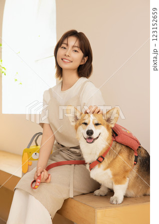 Portrait of a woman sitting with a dog Portrait of a woman sitting with a dog 123152659