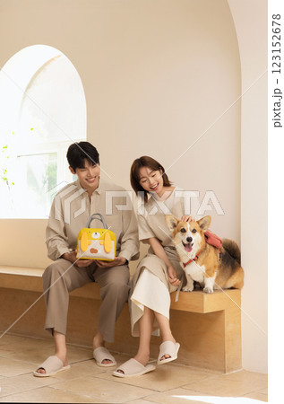 Portrait of a couple sitting with a dog Portrait of a couple sitting with a dog 123152678