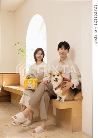Portrait of a couple sitting with a dog 123152721