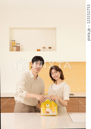 A couple preparing supplies for their dog A couple preparing supplies for their dog 123152753