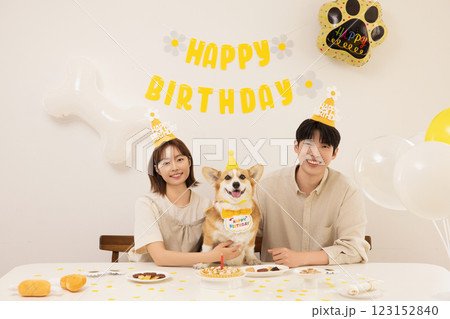 A young couple preparing for their dog's birthday party 123152840