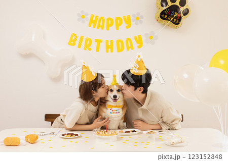 A young couple preparing for their dog's birthday party 123152848