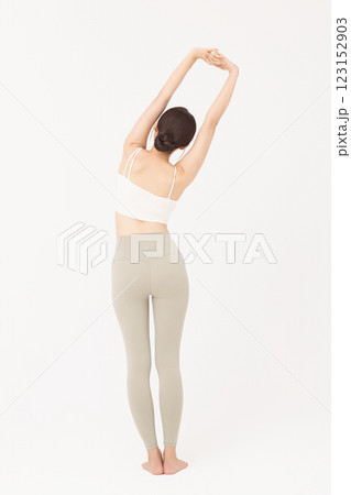 Portrait of young woman stretching in sportswear Portrait of young woman stretching in sportswear 123152903