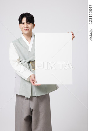 Portrait of a young man wearing hanbok and standing with copy space 123153047