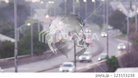 Globe image over busy highway with cars and streetlights Globe image over busy highway with cars and streetlights 123153238