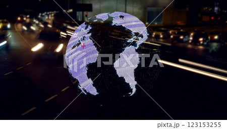 Globe with red circle highlighting North America, image over busy city street at night 123153255