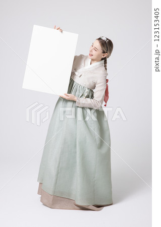 Portrait of a Western woman wearing Hanbok and standing with copyspace 123153405