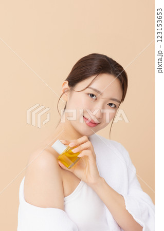 Portrait of beautiful young woman posing with oil Portrait of beautiful young woman posing with oil 123153653